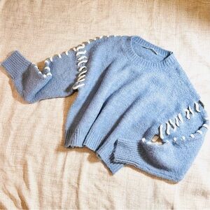 Blue Sweater with White whipstitch